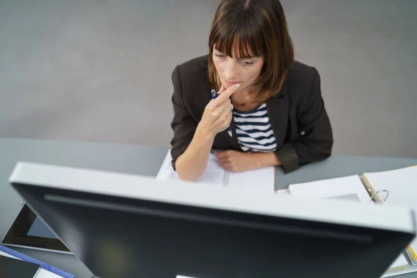 Businesswoman Facing her Computer Monitor