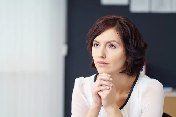 Pensive Woman Looking Away In the Office