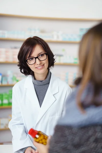 Approachable Female Pharmacist Talking to Customer