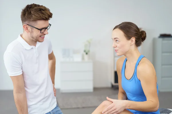 Physical Therapist and Patient Talking Happily