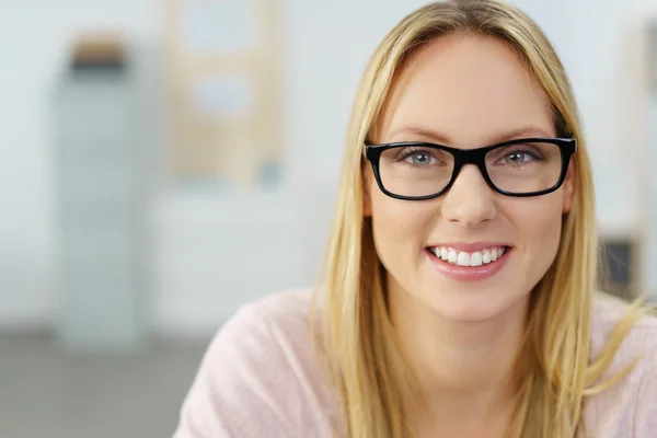 Smiling Attractive Woman Against Blurred Office