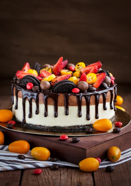 Chocolate cheesecake decorated with fresh fruits