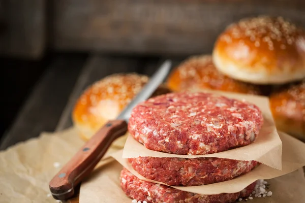 Raw ground beef meat steak cutlets and burger buns