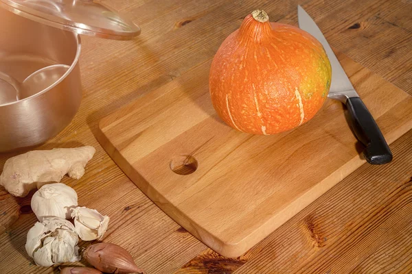 Cooking scene - preparing a pumpkin soup on a countertop