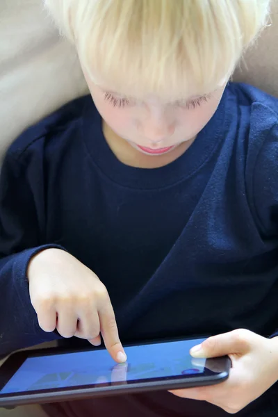 Young Child Playing Internet Game on Computer Tablet