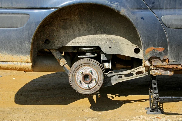 Car Lifted On Jack to Change Tire