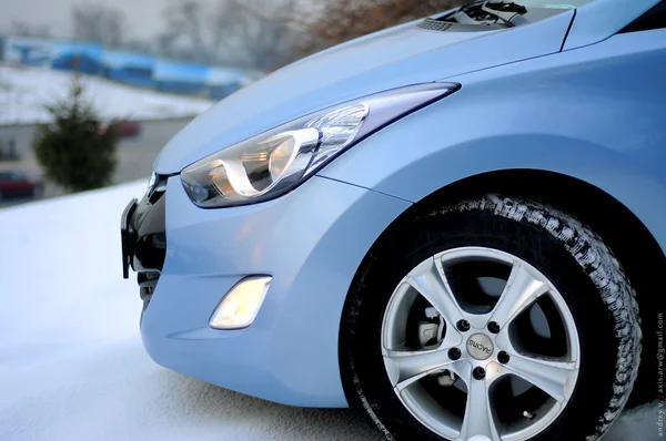 Blue car in winter on the snow