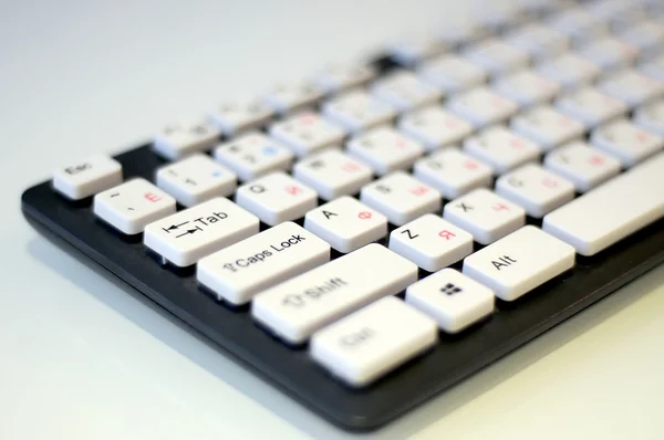 Black keyboard with white buttons keys