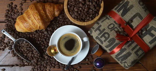 Shot Of Coffee And Croissant On Table