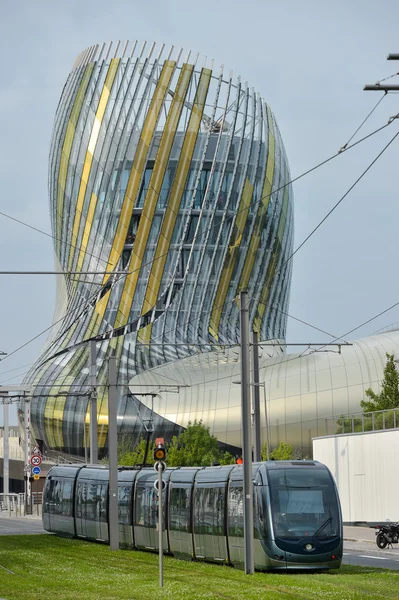 Bordeaux, France, Tram rolling next to La cite du vin, the Wine museum of Bordeaux near to Garonne river
