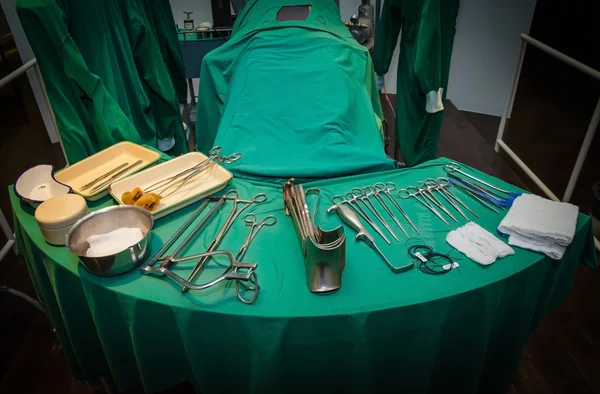 Surgeon and old surgical tools.