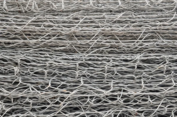 Steel iron raw wire fence texture in a warehouse