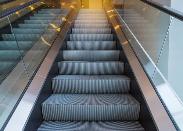 Escalators stairway inside modern office building