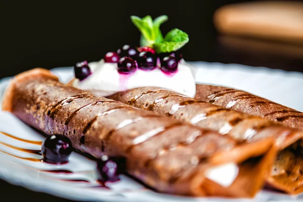 Tiramisu Pancakes with cream and berries, sweet, watering chocolate