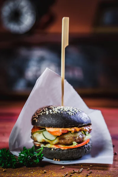 Burger with a black bun, tasty food