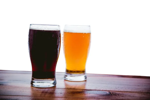 Dark and light beer on the bar on a white background