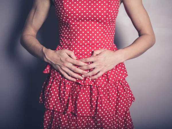 Young woman with a belly ache