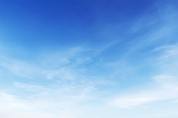 Fantastic soft white clouds against blue sky background - Stock