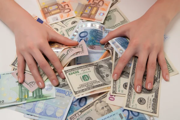 Women can enjoy money in euros and dollars lying on the table