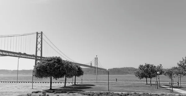 Lisbon, Portugal - May 15: 25th of April bridge in Lisbon on May 15, 2014. 25th of April bridge was originally named for Portugal\'s right-wing dictator, Antonio de Oliveira Salazar. Portugal, Europe.