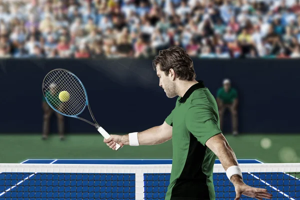 Tennis player with a green shirt.