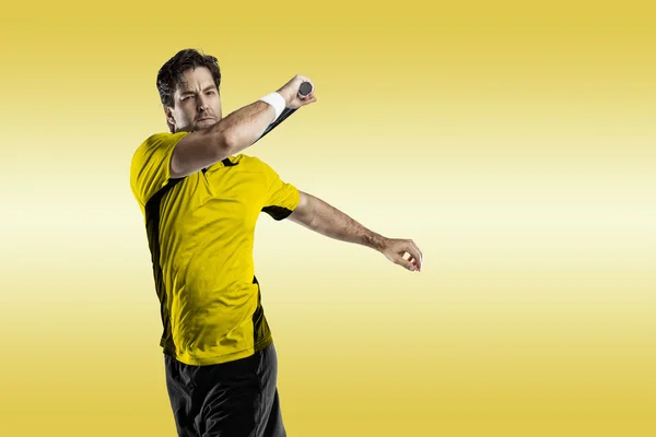 Tennis player with a yellow shirt.