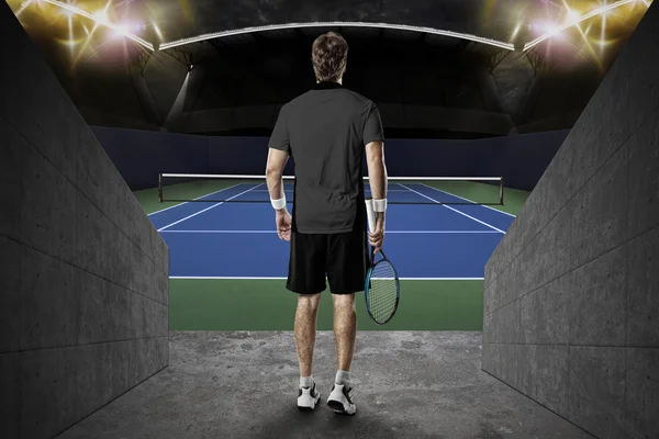 Tennis player with a black shirt.