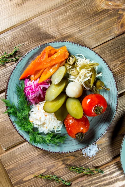 Pickled vegetables - cucumber, tomato, pepper, cabbage. Preserved food