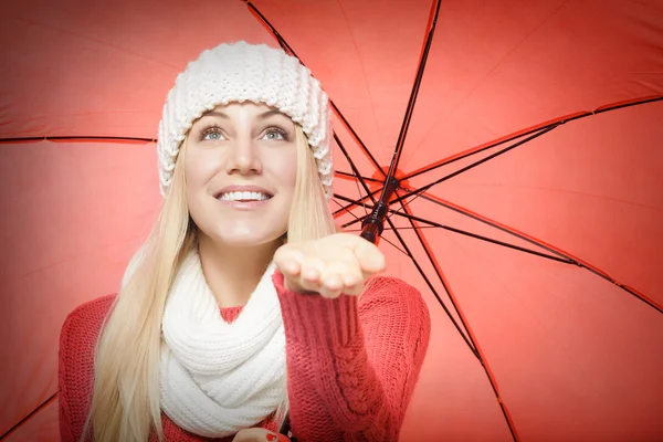 Blonde with red umbrella.