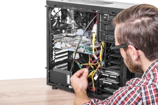 Computer engineer repairs the computer.