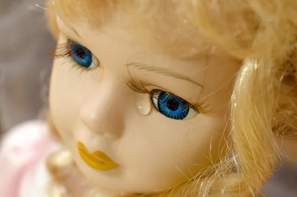 Close up of a doll face. Children\'s toy doll.