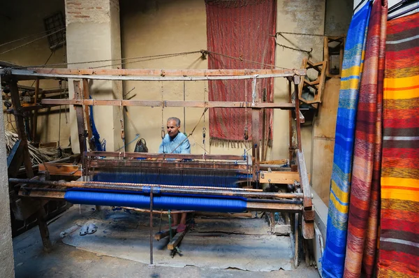 Morrocan man making cloth on a loom in Fez,Morocco.