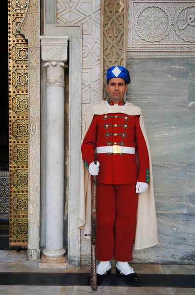 Royal guard in front of the Hassan Tower and Mausoleum of Mohammed V in Rabat.