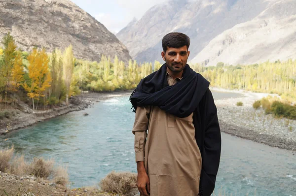 Unidentified Pakistani man standing by the river at Ghizer Valle