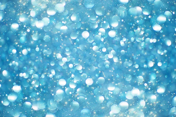 Abstract blue glitter background. Shiny glitter bokeh christmas