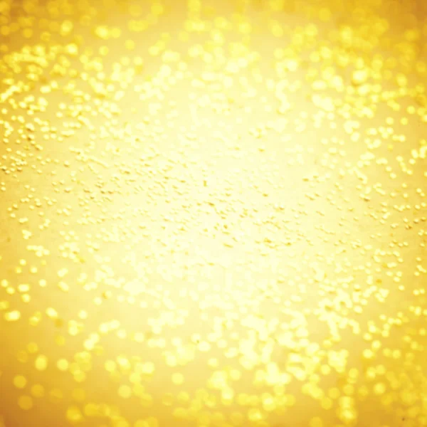 Abstract Golden glitter texture. Defocused Festive Christmas and