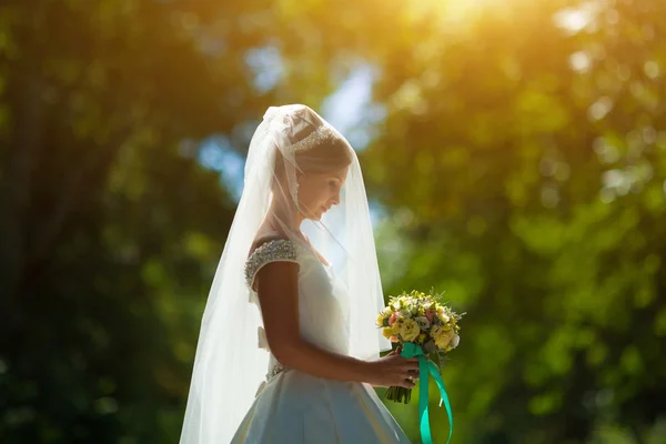 Bride holds a wedding bouquet