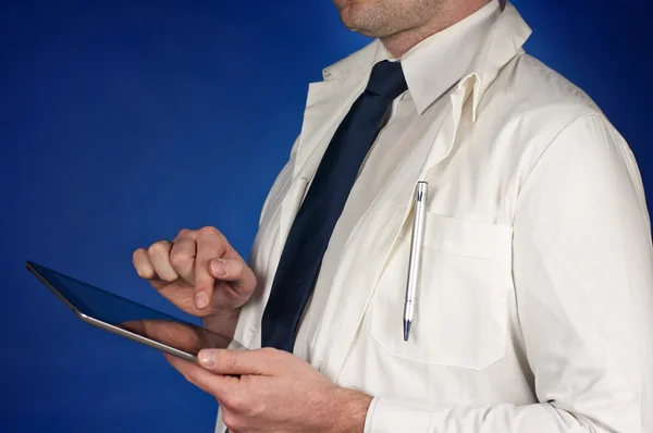 Modern doctor wearing tie with tablet isolated on blue