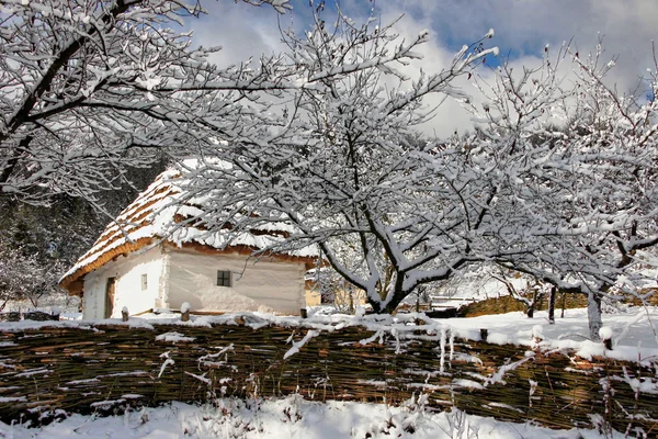 Fairy-tale winter authentic house with whitewashed walls of wove