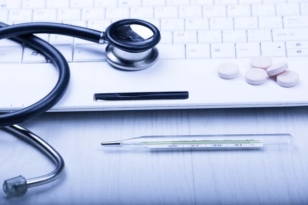 Medical devices on the table at the doctor with blue toned