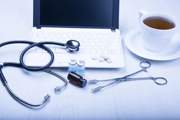 Medical devices on the table at the doctor with blue toned