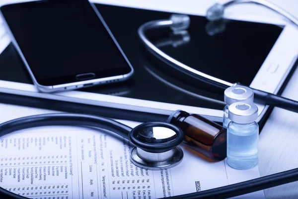 Medical devices on the table at the doctor with blue toned