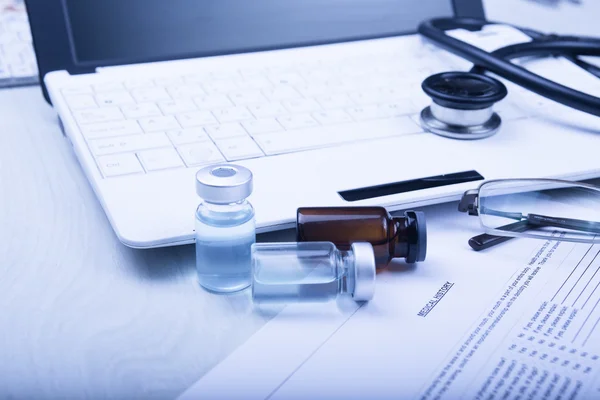 Medical devices on the table at the doctor with blue toned