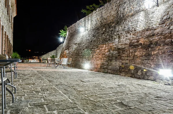 Restaurant on fortress of old town Budva at night