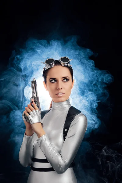 Woman in Silver Space Costume Holding Pistol Gun