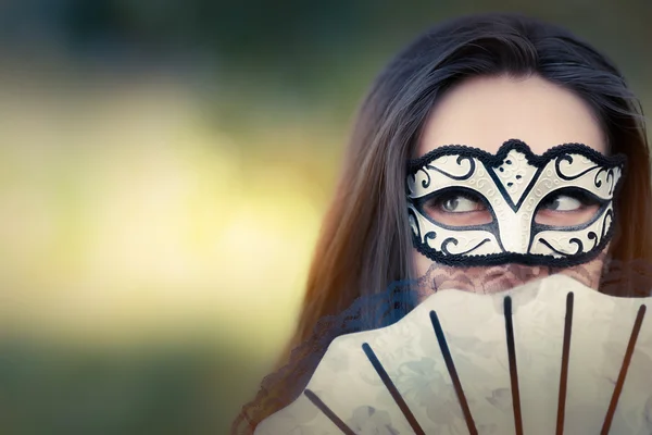 Young Woman with Mask and Fan