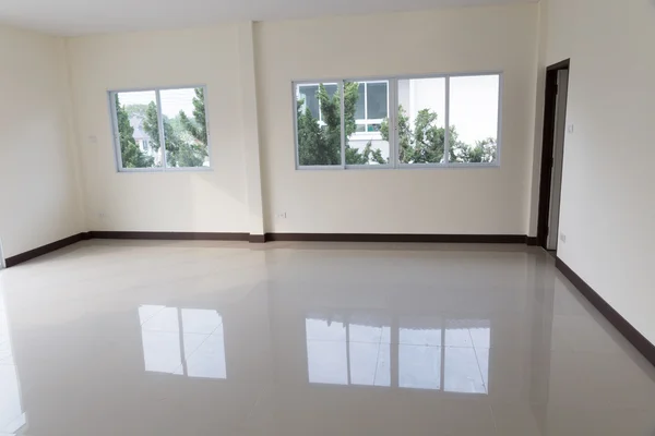 Room with sliding window and beige tile floor