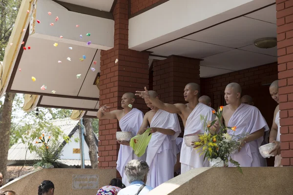 Man donate money for people in buddhist monk ordination ceremony