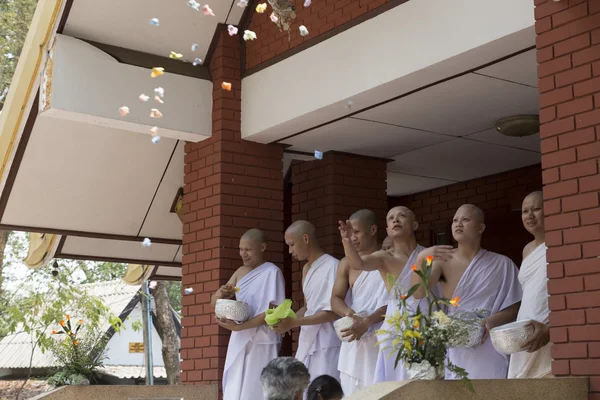 Man donate money for people in buddhist monk ordination ceremony