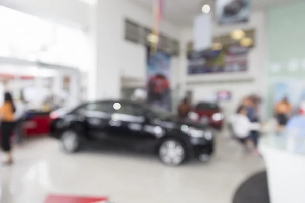 People in car showroom for buyring and selling car business